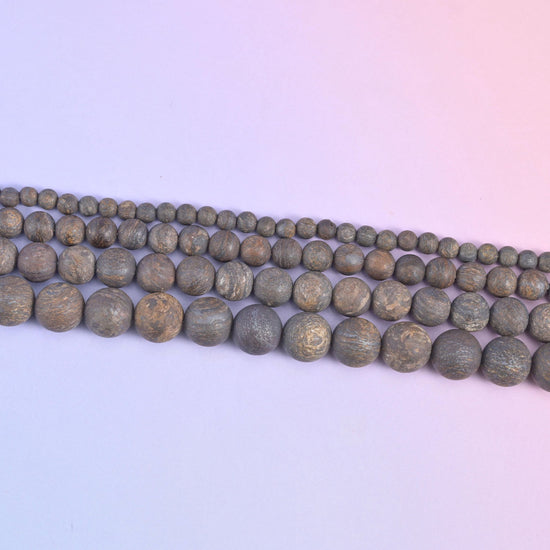 Strands of 4mm through 10mm bronzite rounds running diagonally, the bead sizes stepping up row by row