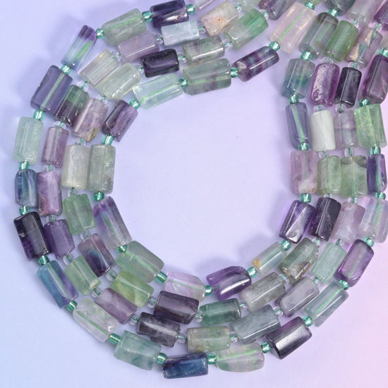 Multi-Color Fluorite faceted tube beads, approximately 29 beads per strand.