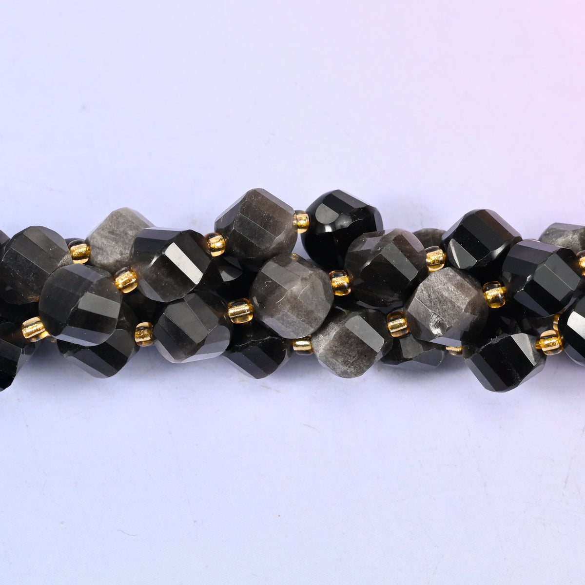 Silver Obsidian natural stone beads used as spacer or focal beads in handmade jewelry designs, 10mm