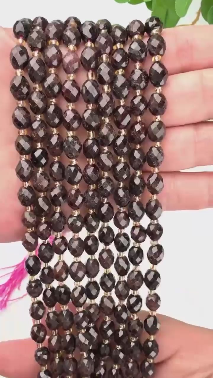 Red Garnet faceted rice barrel beads that flash wine red in the light