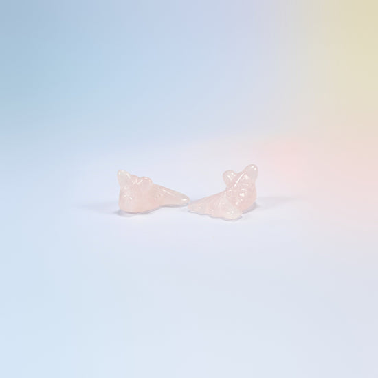Two 1.5 inch natural rose quartz goldfish carvings, light pink with carved scales