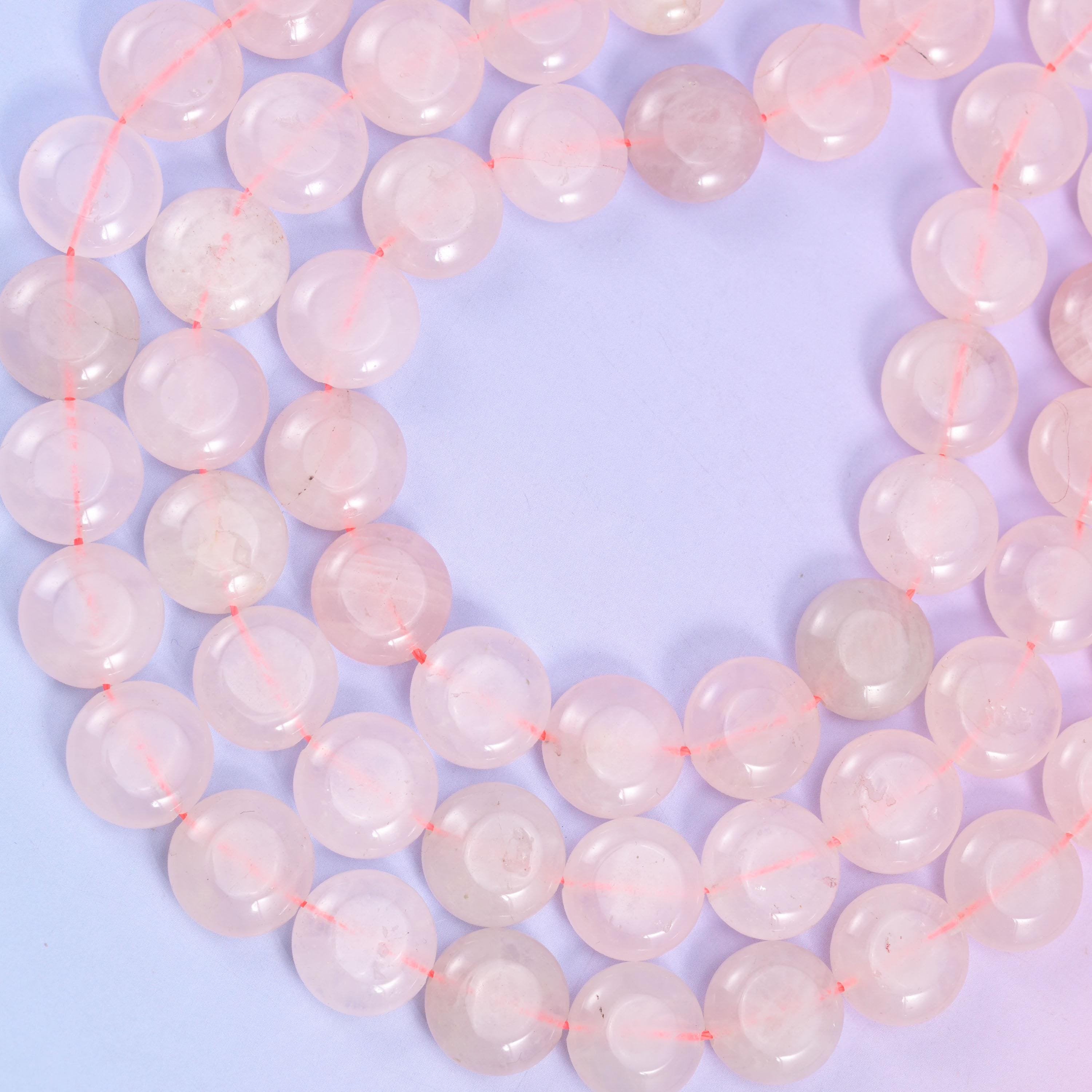 Rose Quartz coin beads, approximately 26 beads per strand