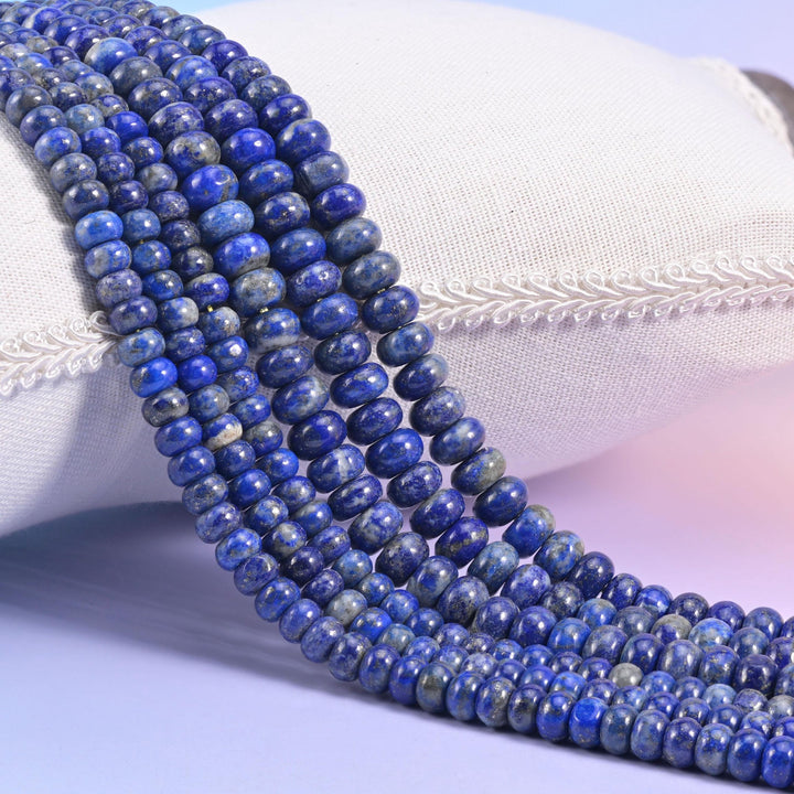 Natural Lapis Lazuli smooth rondelle beads in deep ultramarine blue with grey-white calcite and gold pyrite flecks
