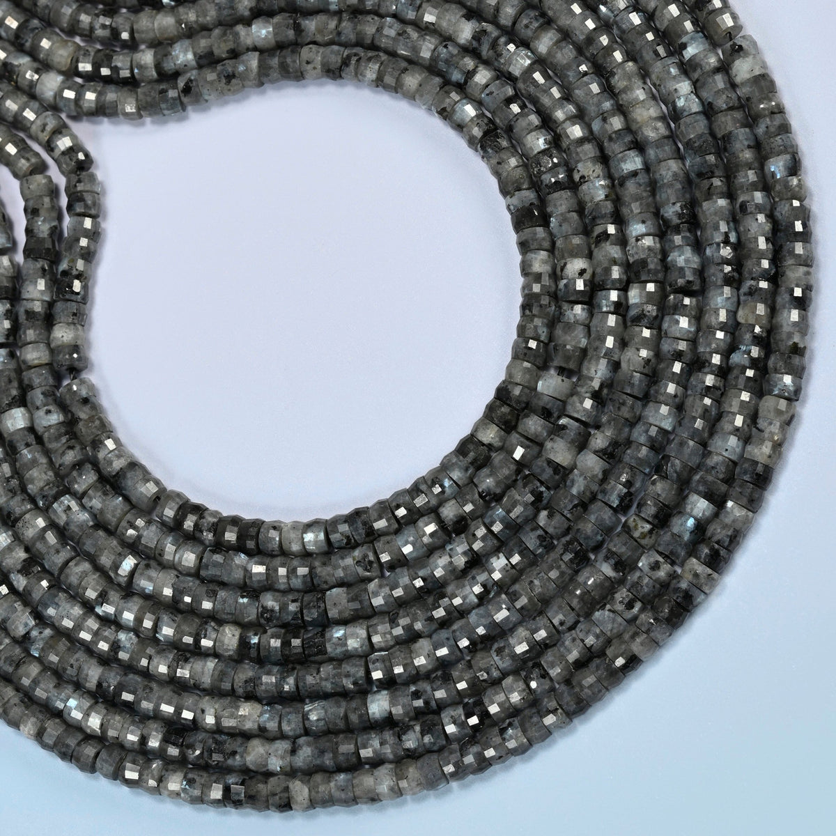 Black labradorite faceted heishi disc beads curved into an open loop, dark gray and black beads with light specks