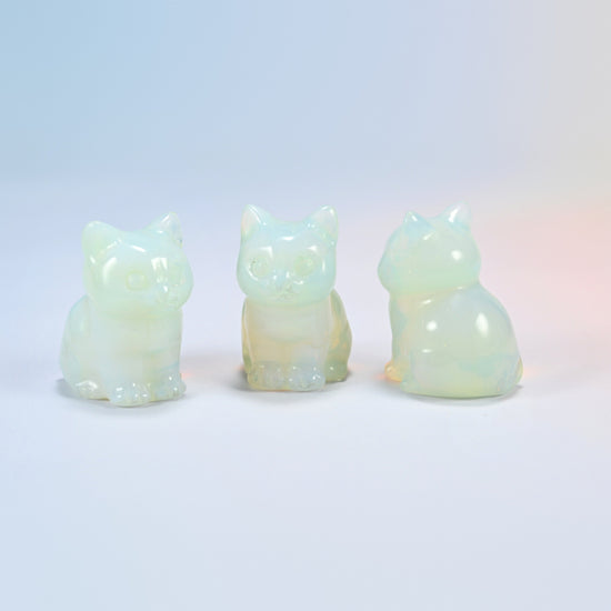 Three opalite sitting cat carvings, 1.5 inch, glowing man-made glass