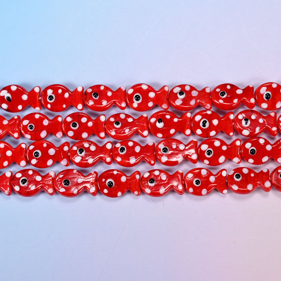 Fish glass beads in opaque tomato-red with white dots