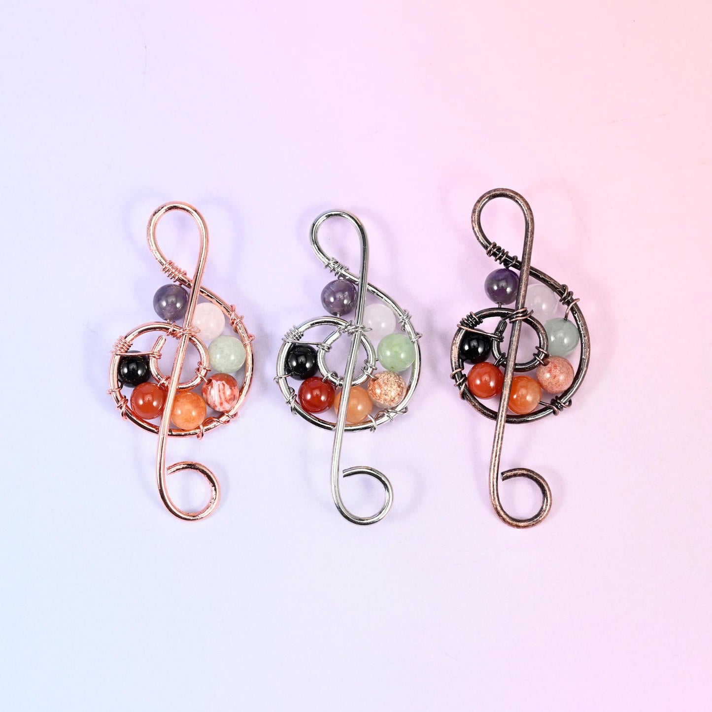 Treble Clef Music Symbol Pendant in purple, orange, pale green, black and clear gemstone beads