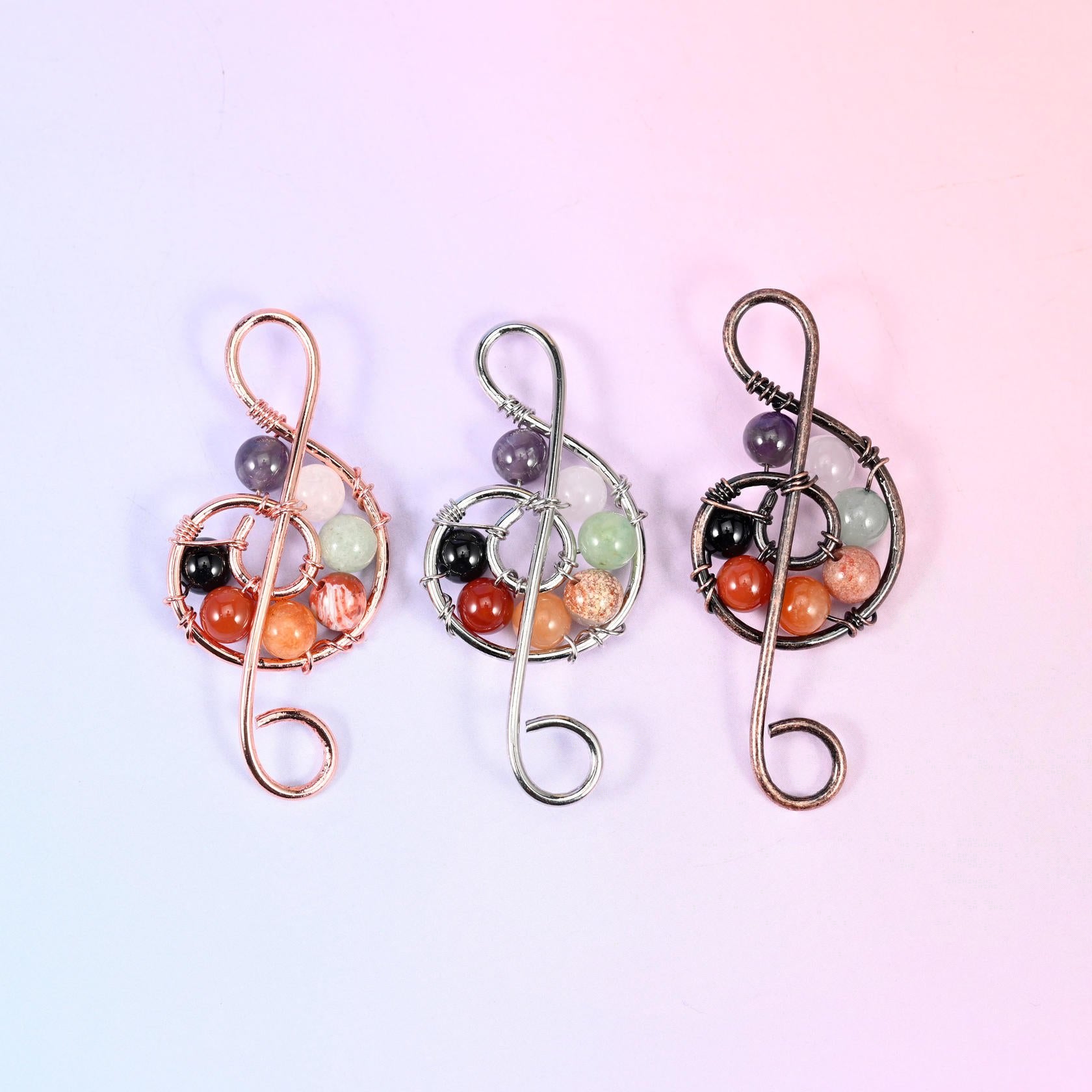 Treble Clef Music Symbol Pendant in purple, orange, pale green, black and clear gemstone beads