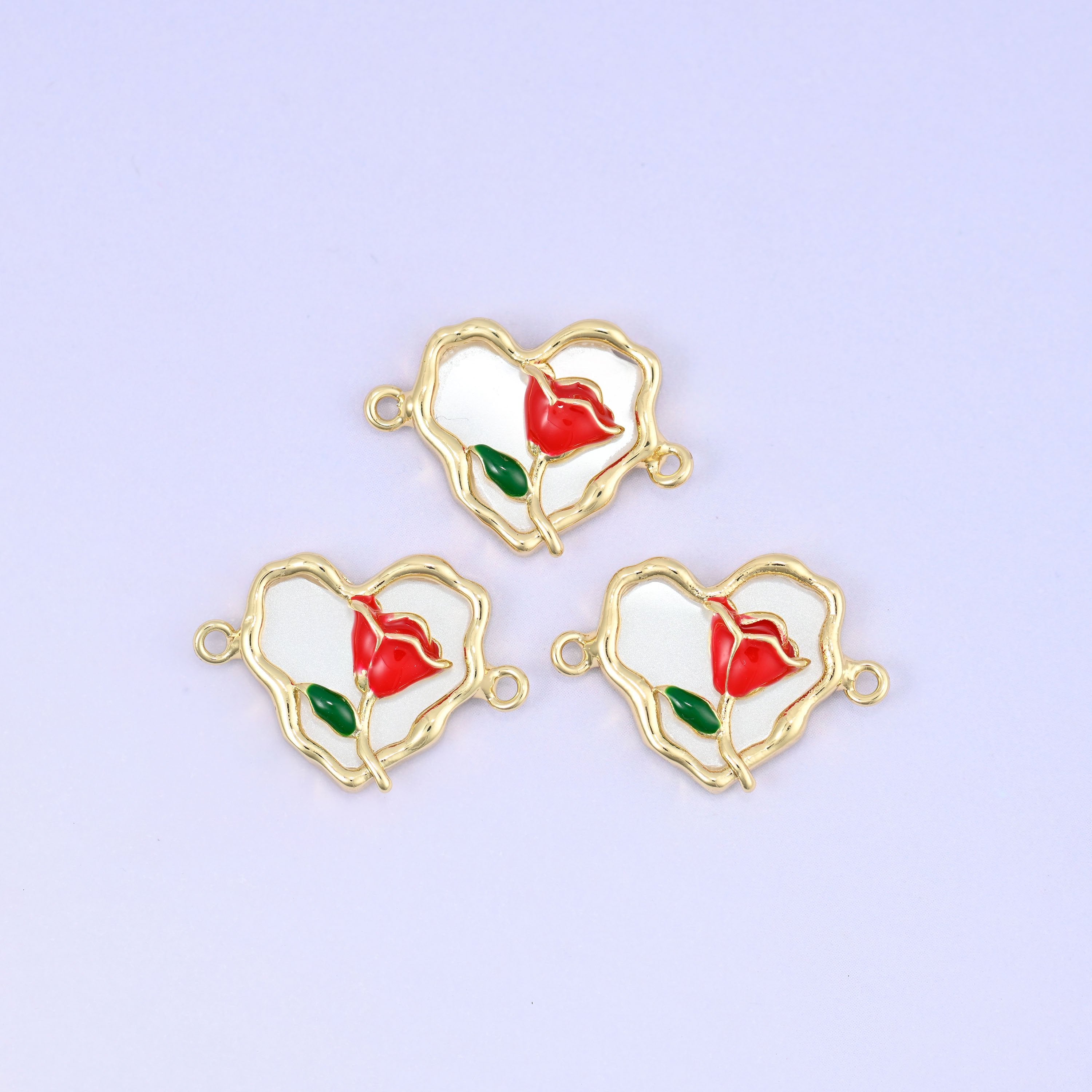 Scalloped heart pendant with red enamel rose, green leaf and white enamel back