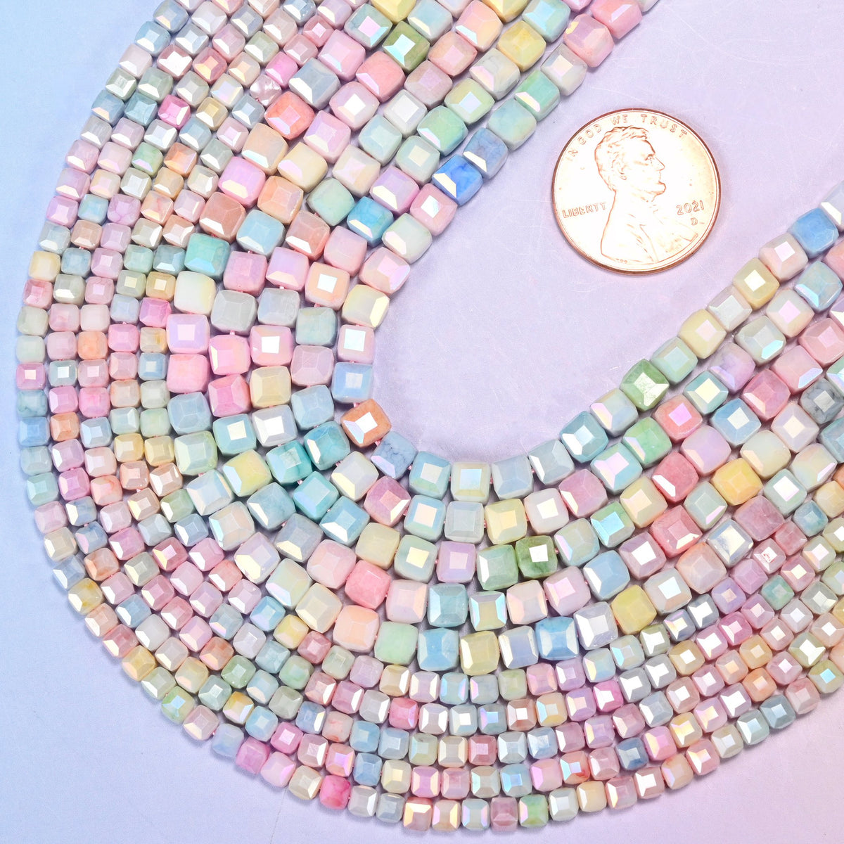 Faceted cube glass beads, drill hole approximately 1.0mm, centre drilled.