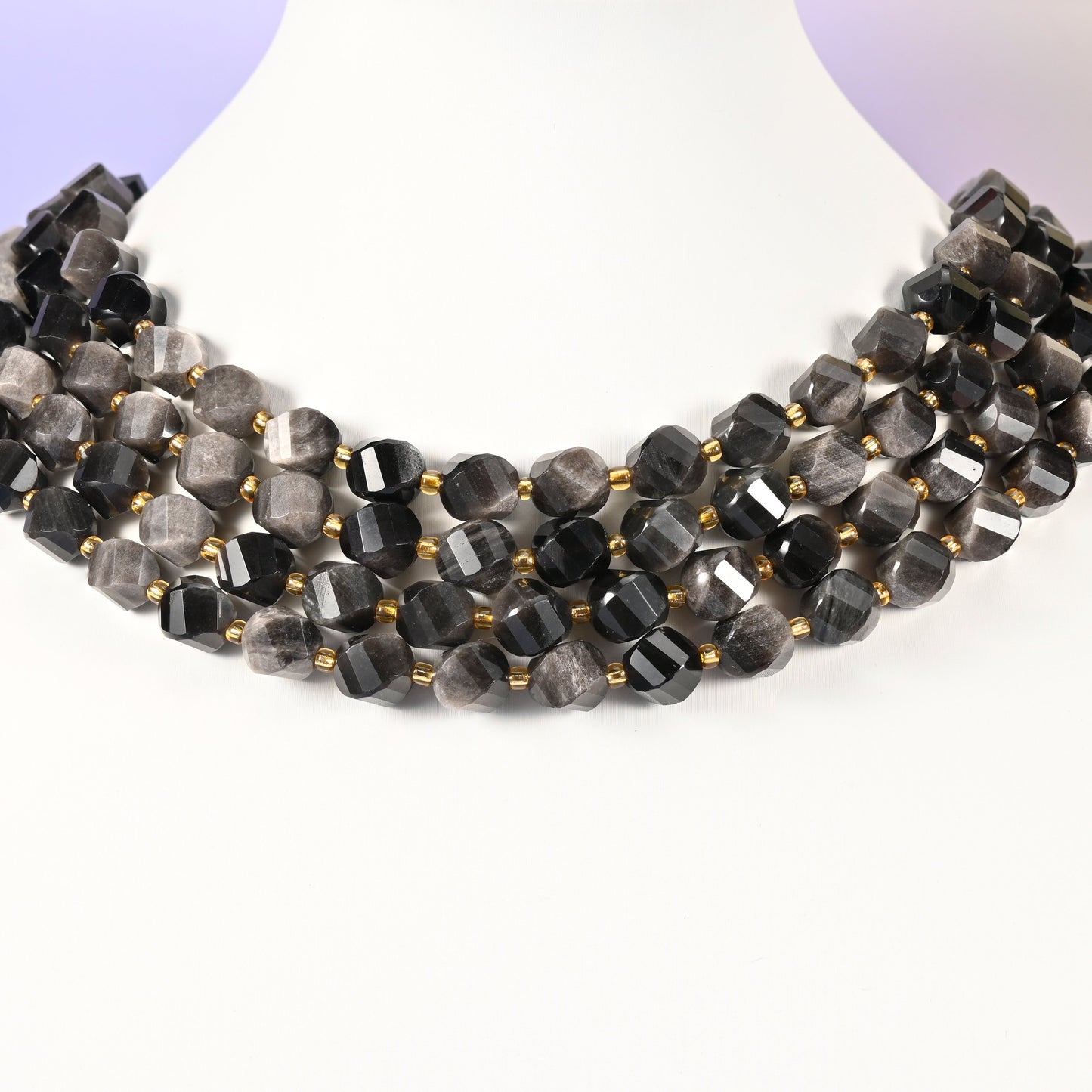 Silver Obsidian natural stone beads showing the silvery sheen banding across the dark 10mm faceted beads as the strand turns