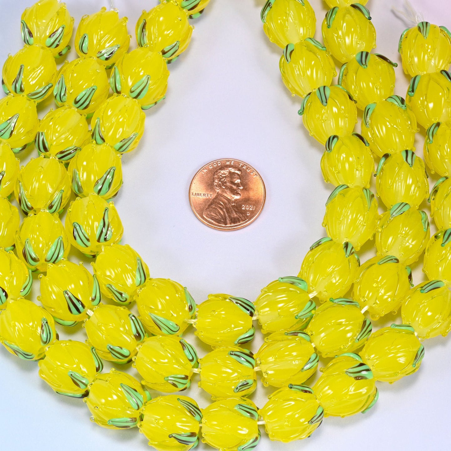 Yellow tulip bud lampwork glass beads, approximately 20 beads per 11 inch strand
