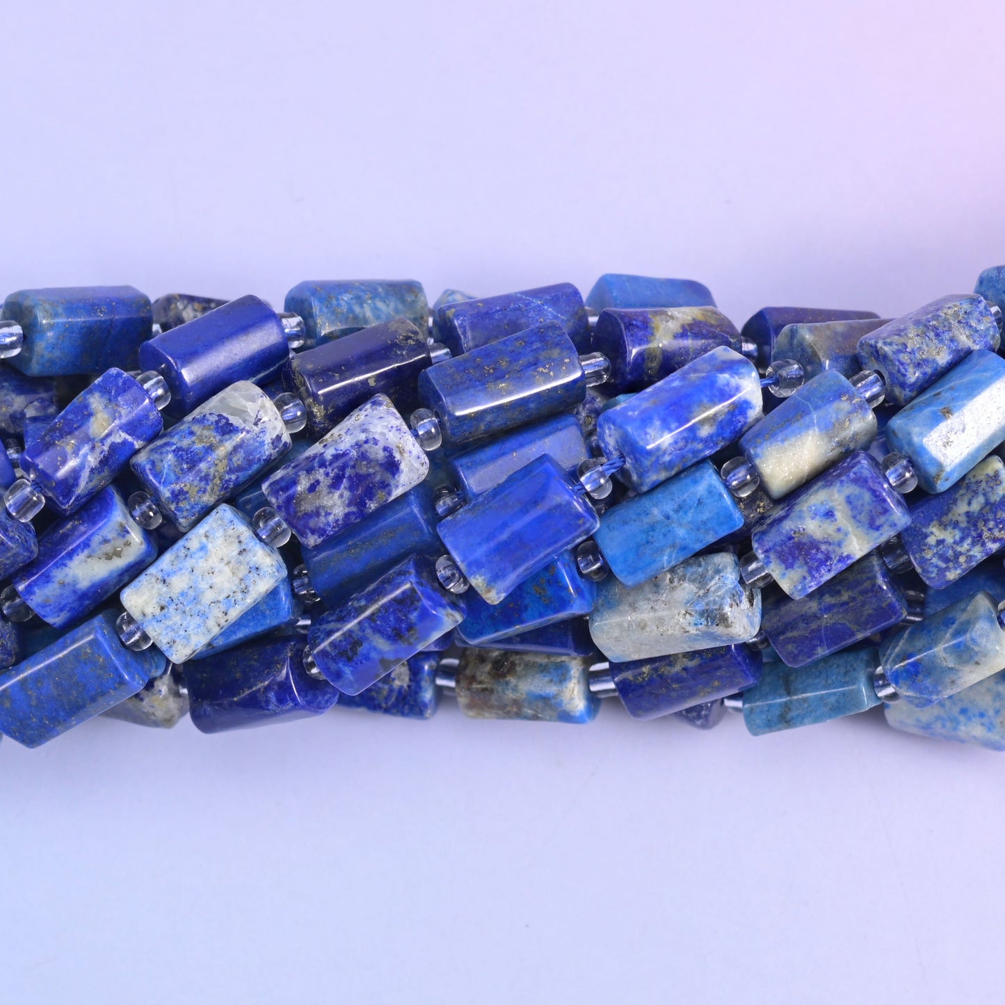 Faceted tube cut lapis beads