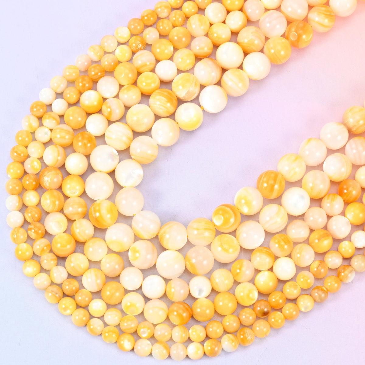 Yellow Pearl Shell Round Beads in golden honey and cream tones