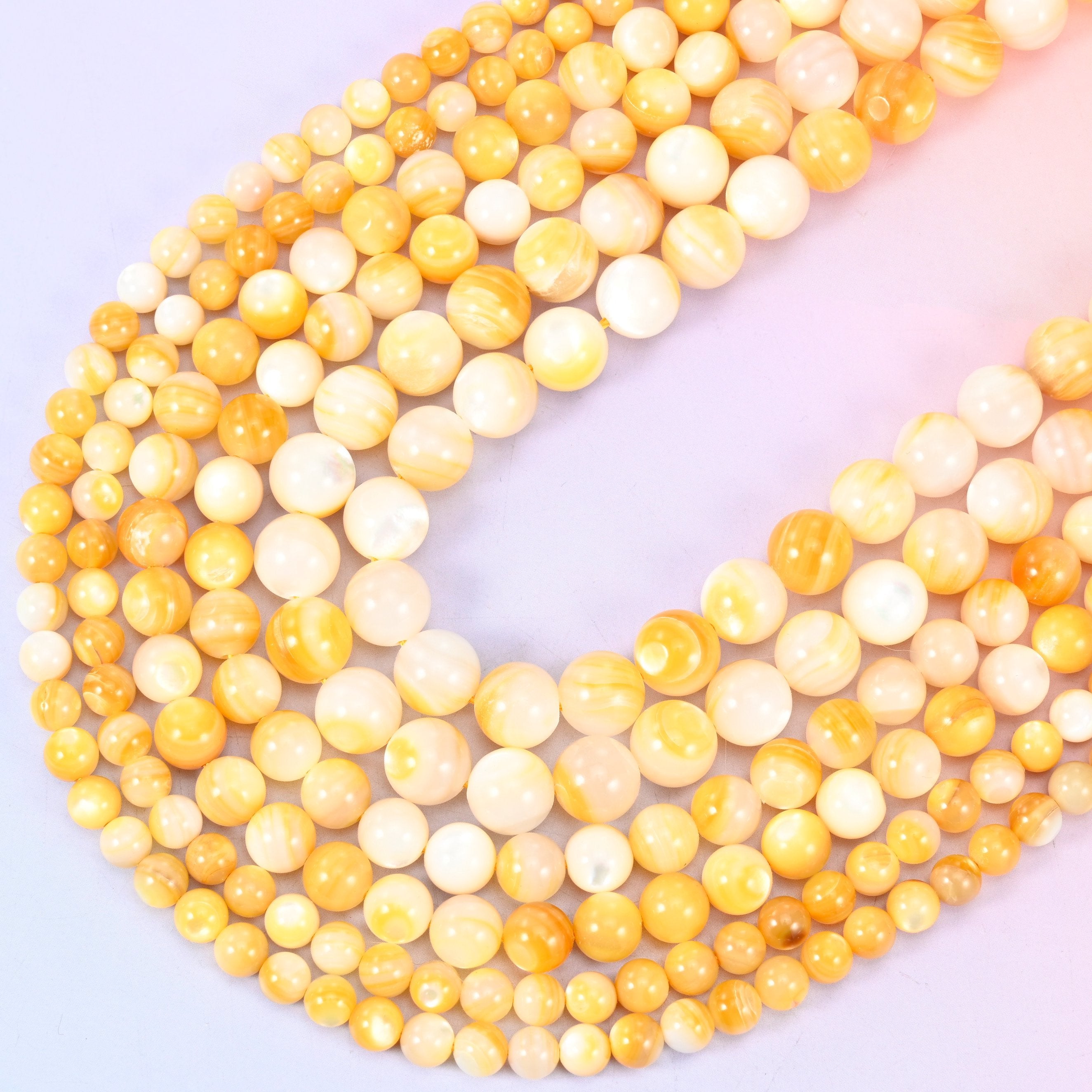 Yellow Pearl Shell Round Beads in golden honey and cream tones