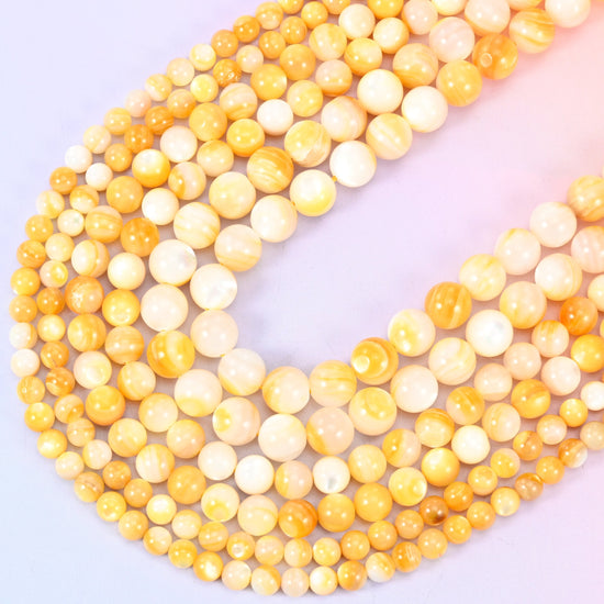 Yellow Pearl Shell Round Beads in golden honey and cream tones