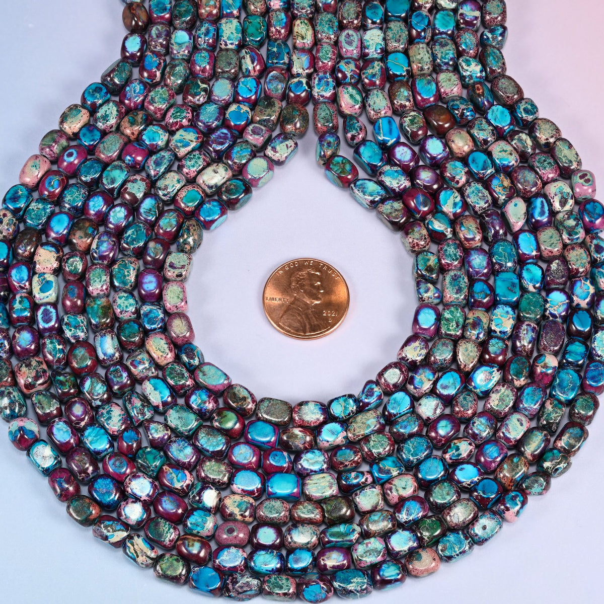 Purple Dyed Sea Sediment Jasper Beads, the applied purple stays even from bead to bead.