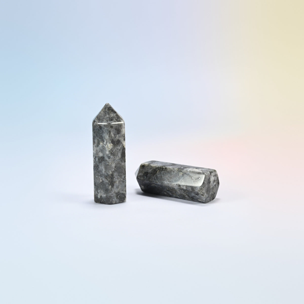 Natural black labradorite hexagon points, gray with dark patches and silvery flashes