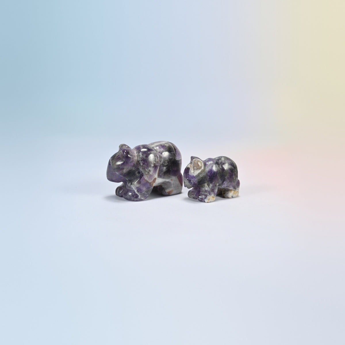 A 2 inch and a 1.5 inch amethyst bear crystal carving, purple and white natural stone