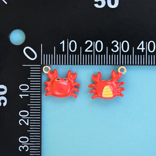 Enamel crab charms measured at 13.98mm wide and 11.14mm tall, front and reverse of the red crab charm
