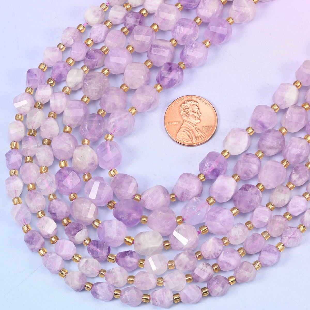 Faceted spiral twist cut natural purple jade beads