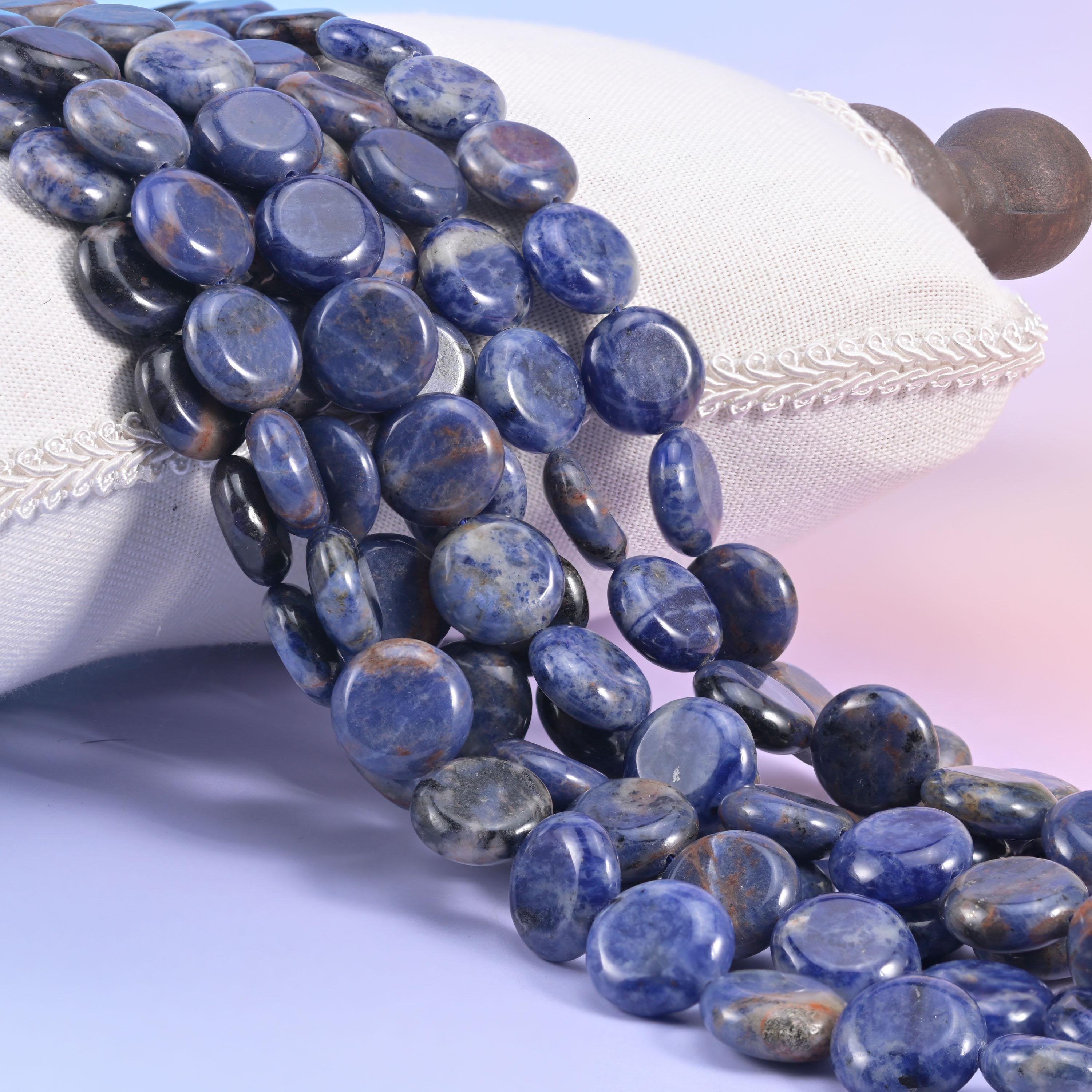 Natural blue Sodalite smooth coin beads in deep denim and navy blue marbled with chalky white veining