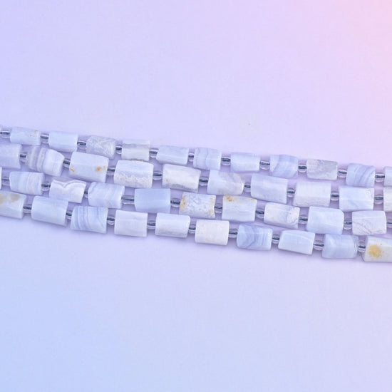 Blue Lace Agate faceted tube beads in a soft blue color.