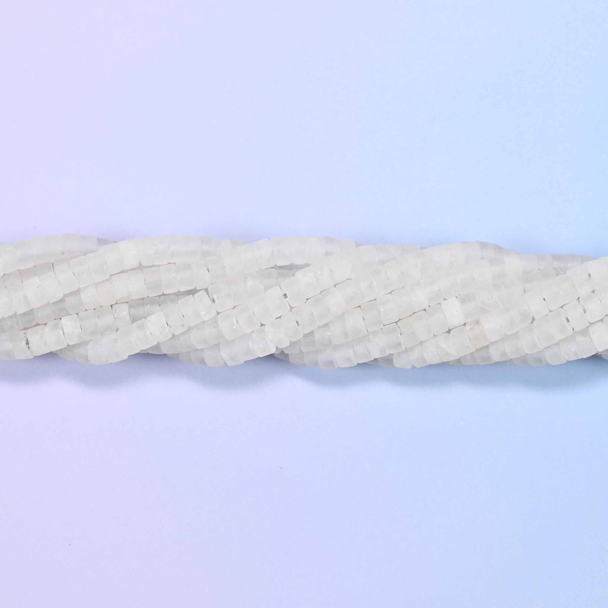 Natural clear quartz matte heishi disc beads in a soft frosted white with a sophisticated matte finish.