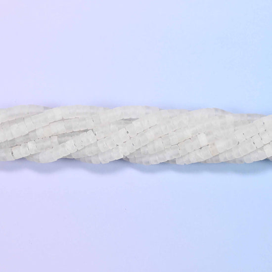 Natural clear quartz matte heishi disc beads in a soft frosted white with a sophisticated matte finish.