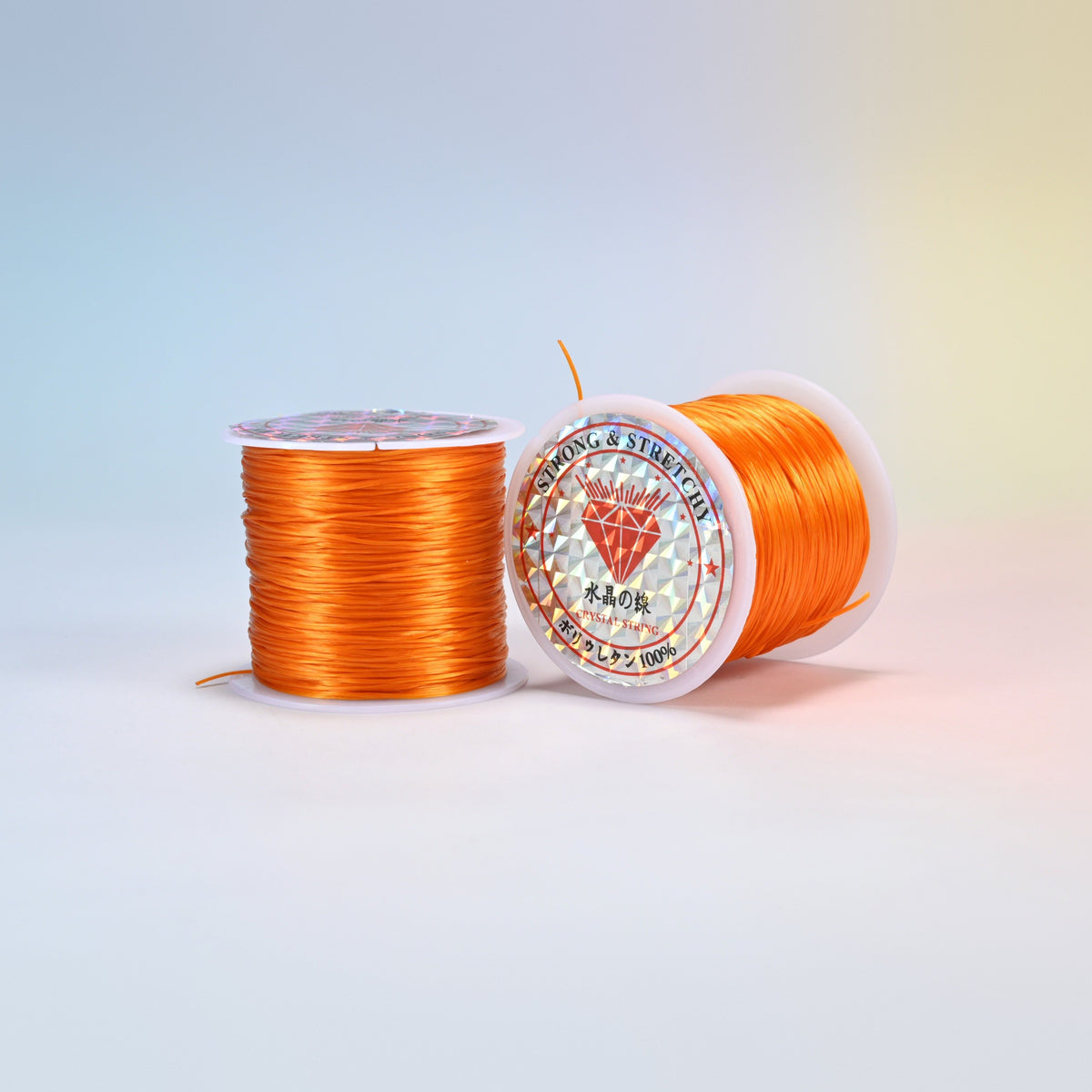 Two rolls of orange 0.7-0.8mm elastic stretch string, glossy polyurethane bead cord with a holographic label