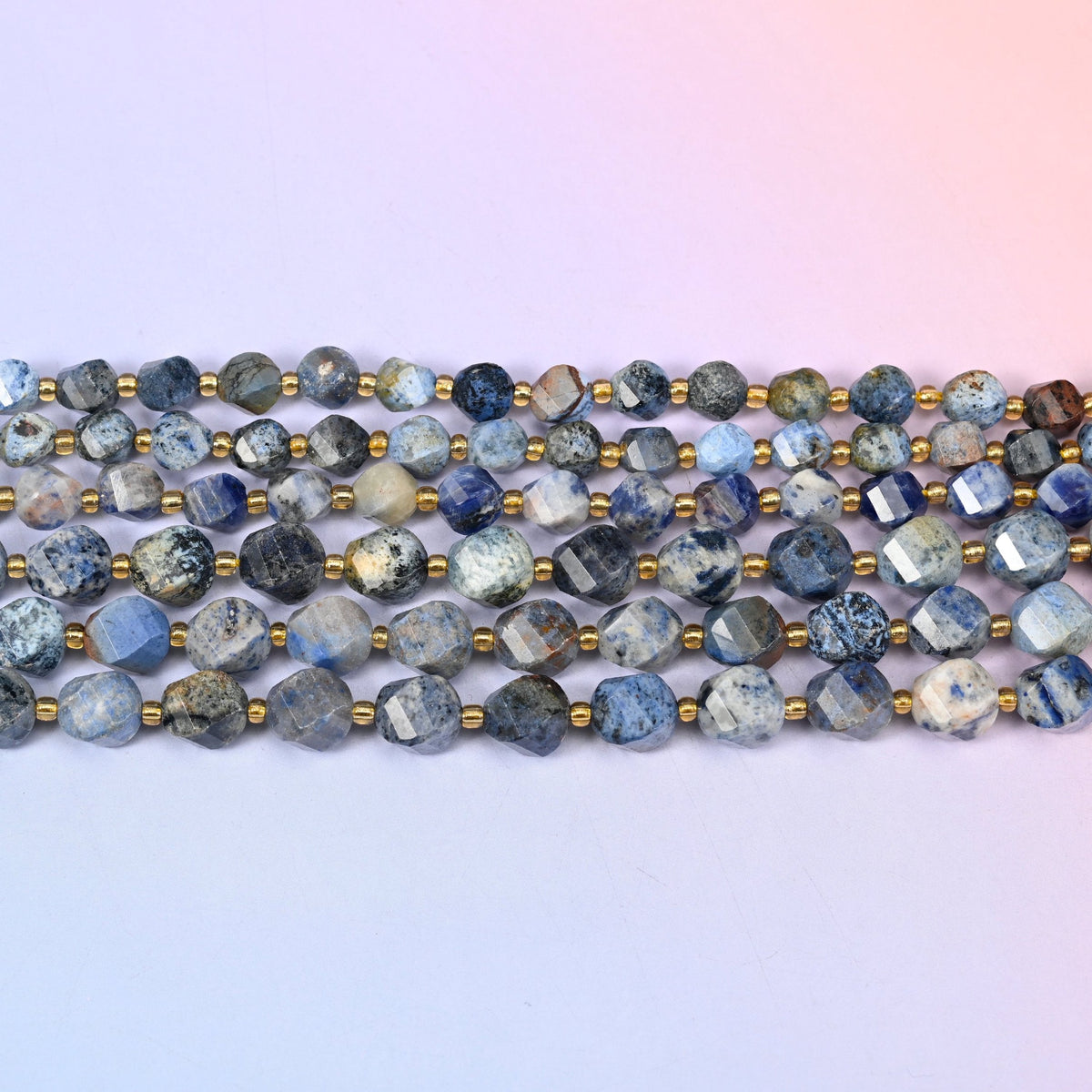 Sunset Dumortierite beads in dusty denim blue and pale grey with rust-brown patches