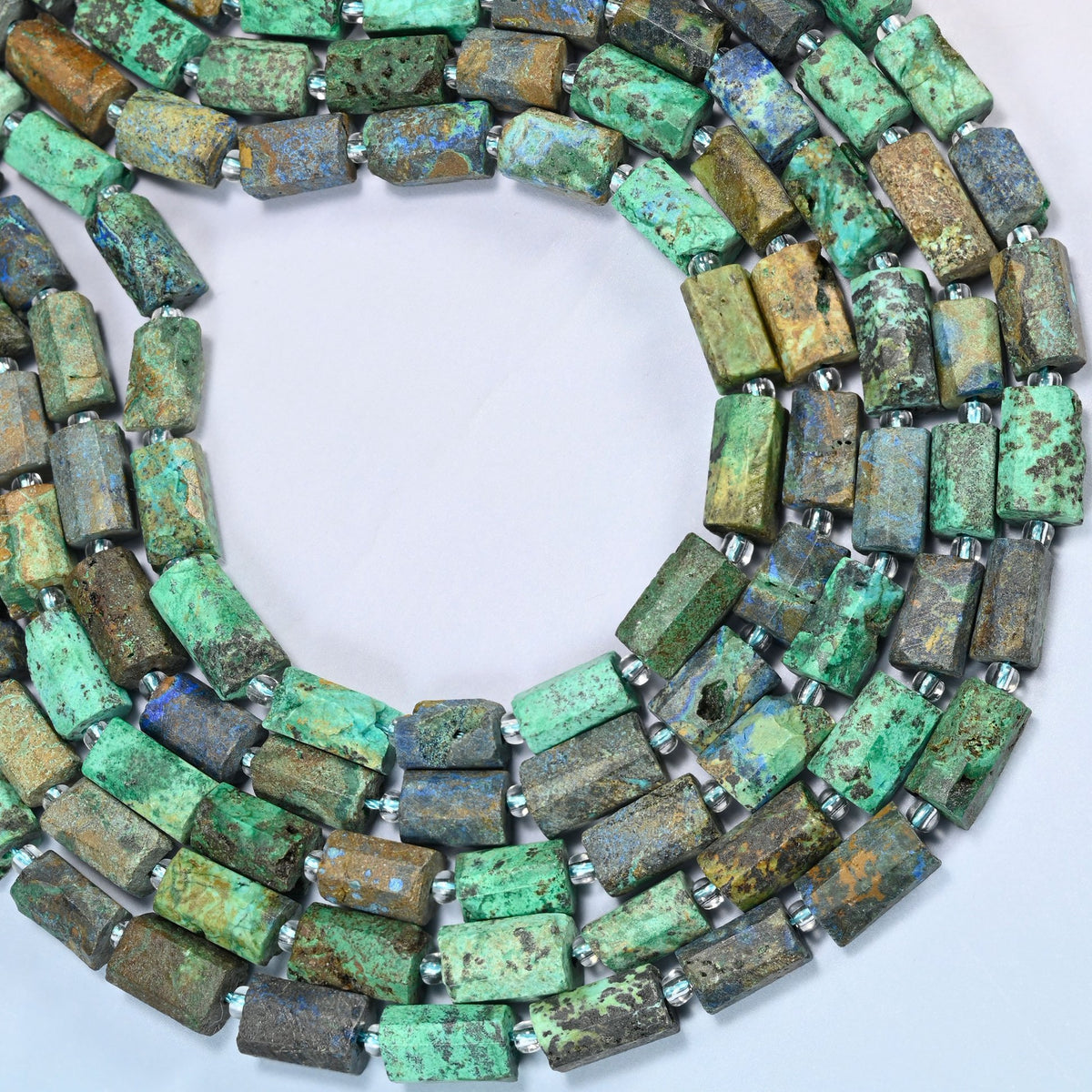 Azurite chrysocolla faceted tube beads curved into an open loop, turquoise green, olive and brown beads