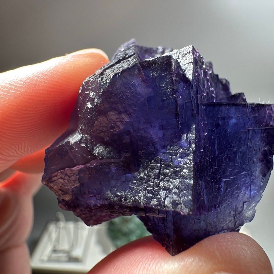 Purple blue Fluorite specimen with a small tan-brown patch on one side, mined in China