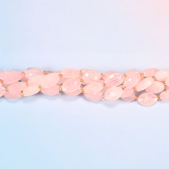 Strands of rose quartz faceted flat oval beads twisted together in a horizontal row