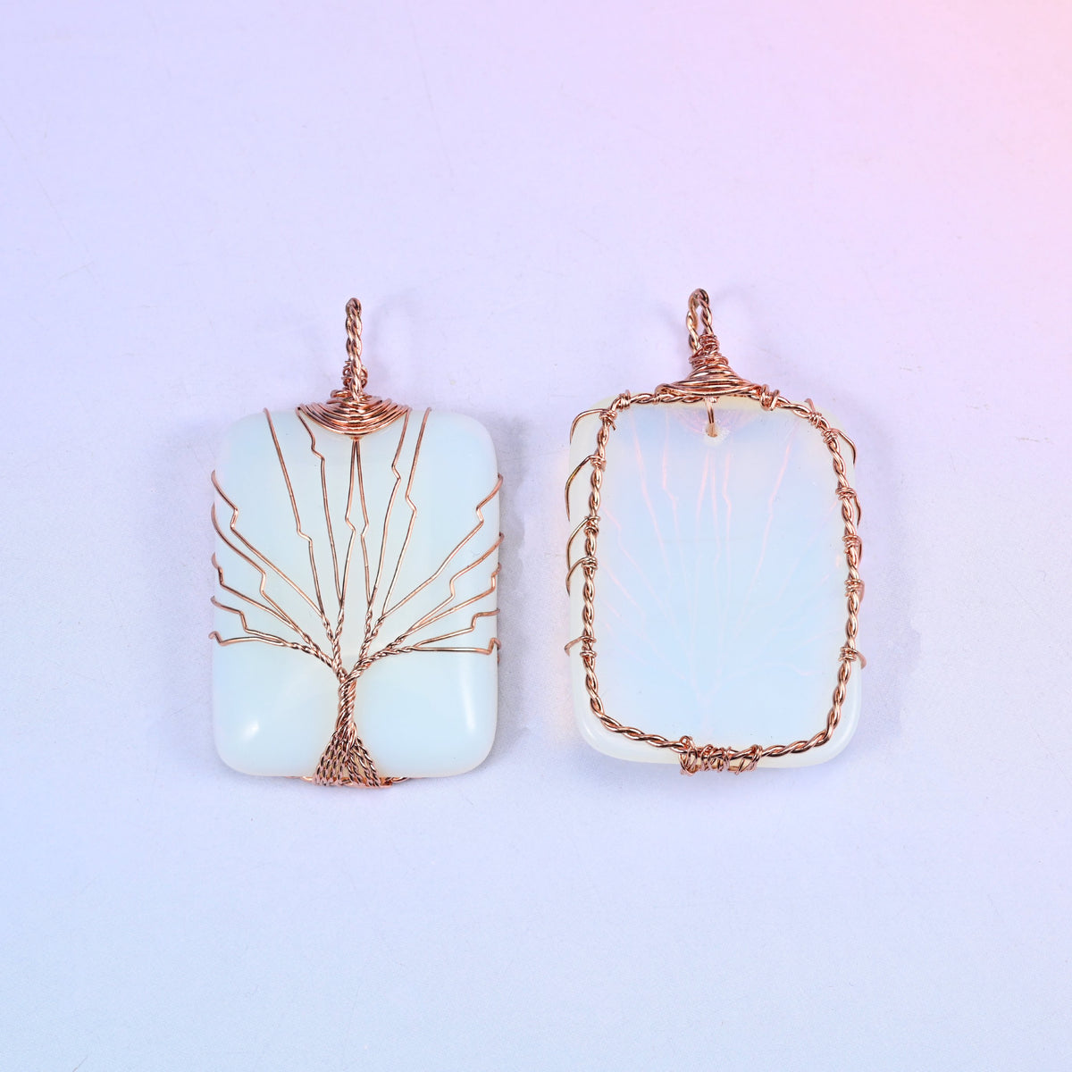 Rectangle Gemstone Tree of Life Pendant in white, front and reverse side by side against a soft lilac gradient background.