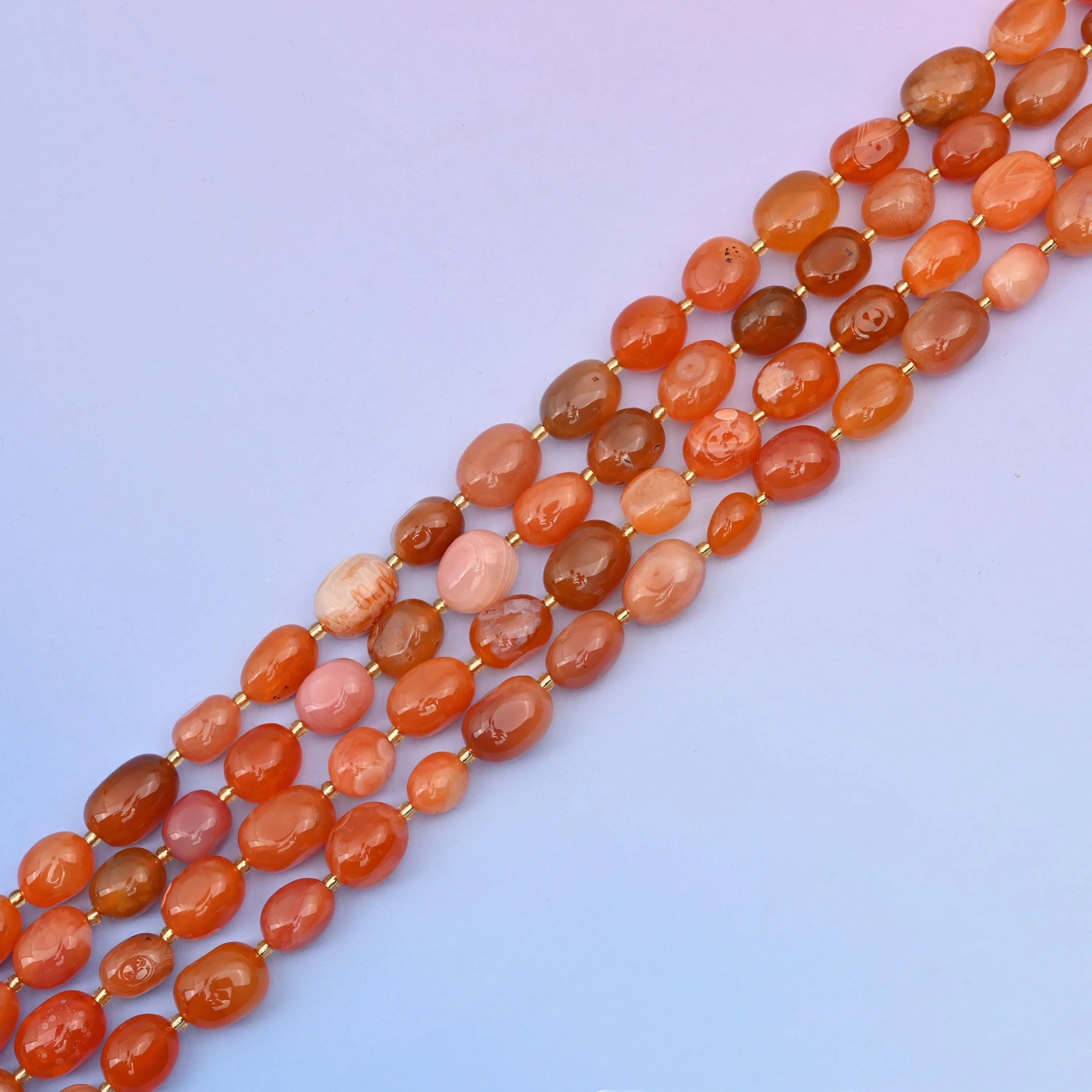Carnelian beads in warm, rich gemstone tones