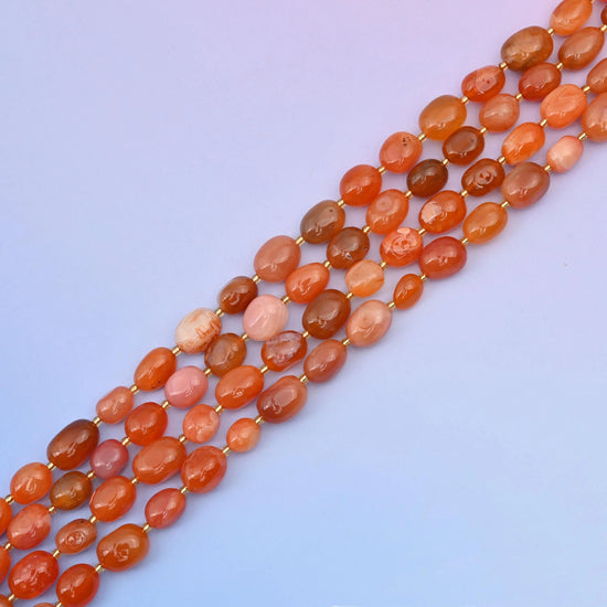 Carnelian beads in warm, rich gemstone tones