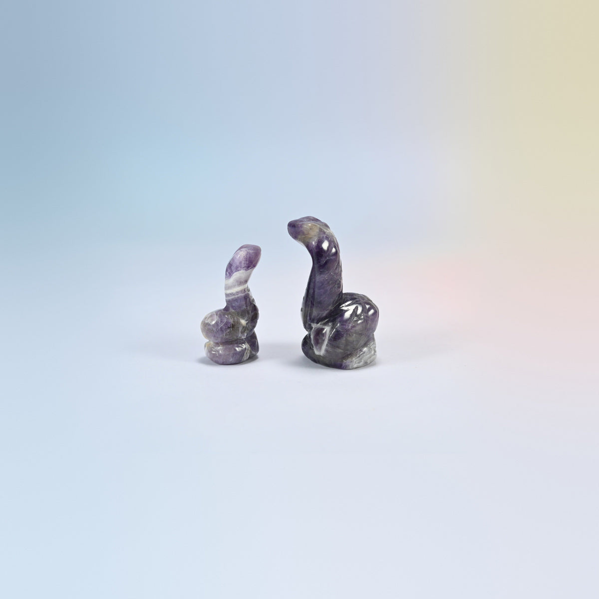 Cobra snake crystal carving in amethyst, purple and white natural stone