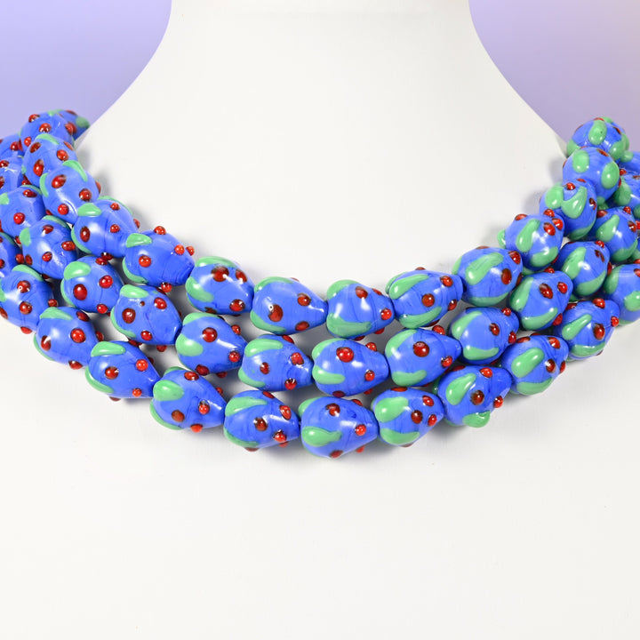 Strawberry glass beads, dark blue with red dots, approximately 15.5x12mm