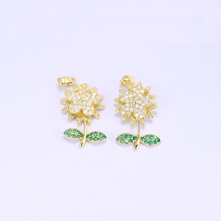 Gold plated flower charms, two pendants shown front on with green zirconia leaves