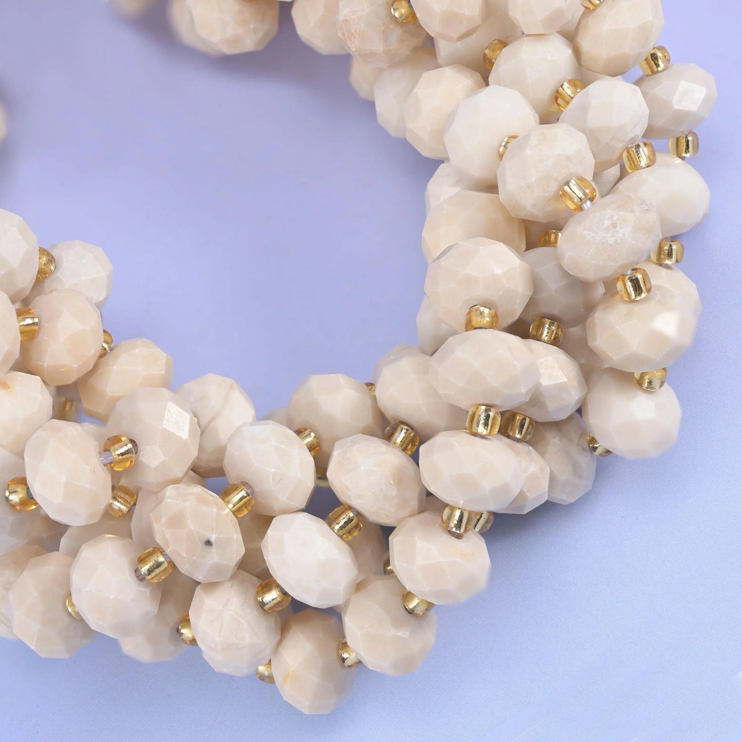 Faceted rondelle cut white fossil jasper beads