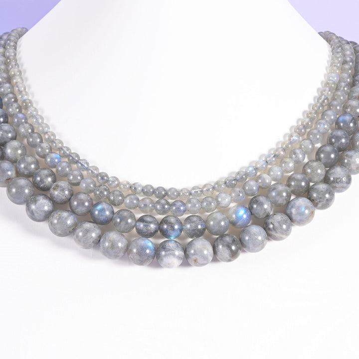 White Labradorite round beads looped around a white neck display form, strands in 4mm, 6mm, 8mm and 10mm