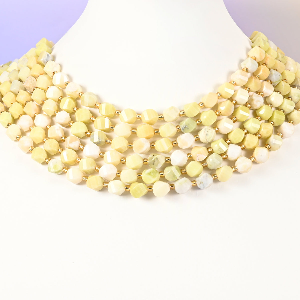 Lemon Jade yellow jade beads with a few beads carrying a green-yellow tint among the 8mm faceted beads