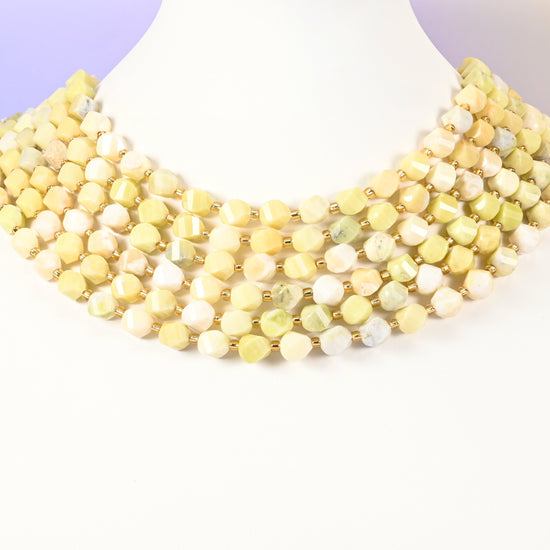 Lemon Jade yellow jade beads with a few beads carrying a green-yellow tint among the 8mm faceted beads