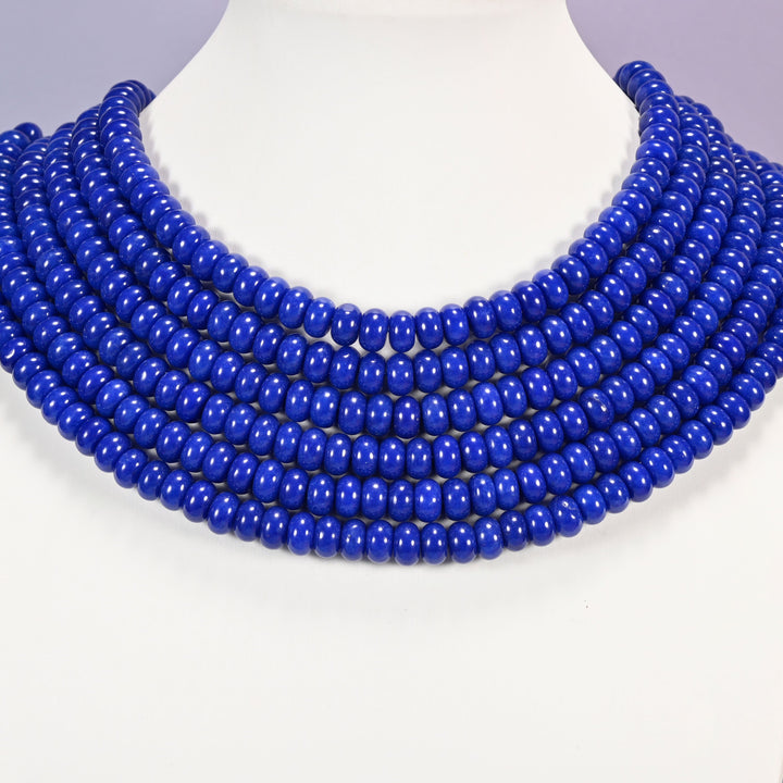 Dark Blue dyed jade gemstone rondelle beads laid in graduated collar rows, 5x8mm discs in an even dark blue