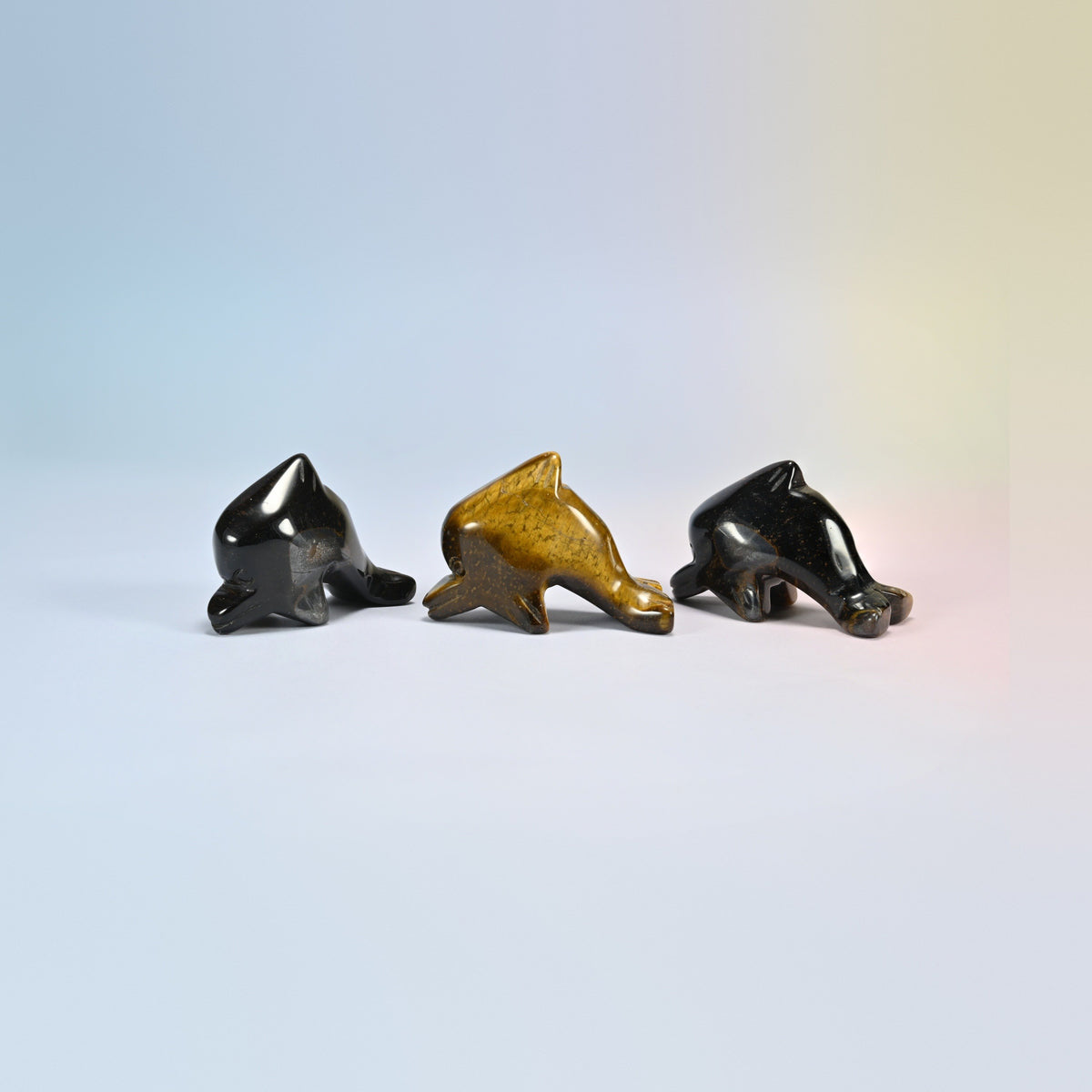 Three tiger eye dolphin crystal carvings, 2 inch, golden brown and dark brown natural stone