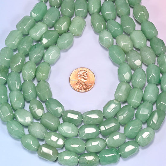 Wide circular coil of green faceted Aventurine barrel beads on a light background, showing the dense wreath pattern.