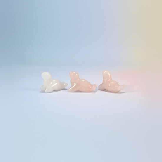 Three rose quartz sea lion crystal carvings, 1.5 inch, light pink natural stone