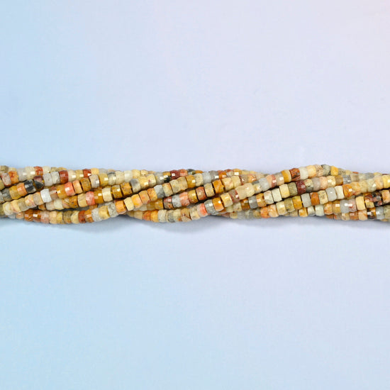 Strands of crazy agate faceted heishi disc beads twisted together in a horizontal row