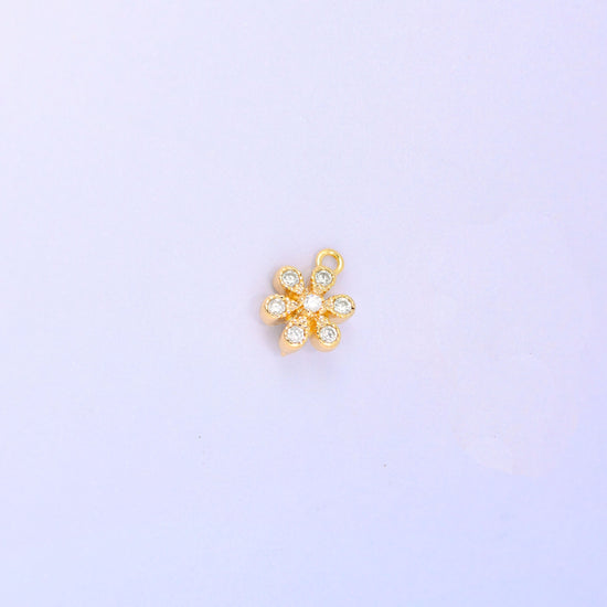 Small gold charms, a single 18K gold plated flower charm with clear cubic zirconia